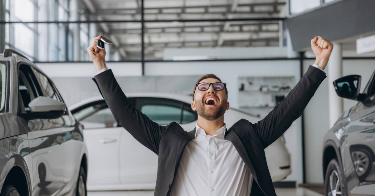 man at dealership excited