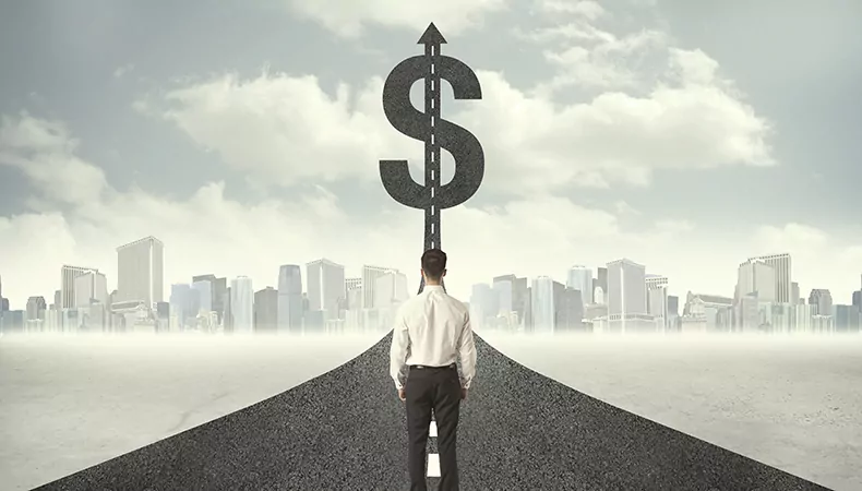 Business man on road heading toward a dollar sign concept