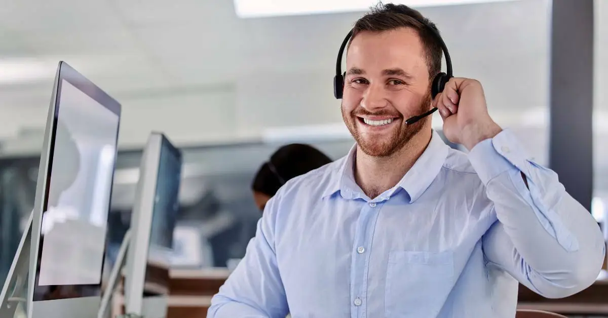 dealership salesperson at desk using Autosoft DMS