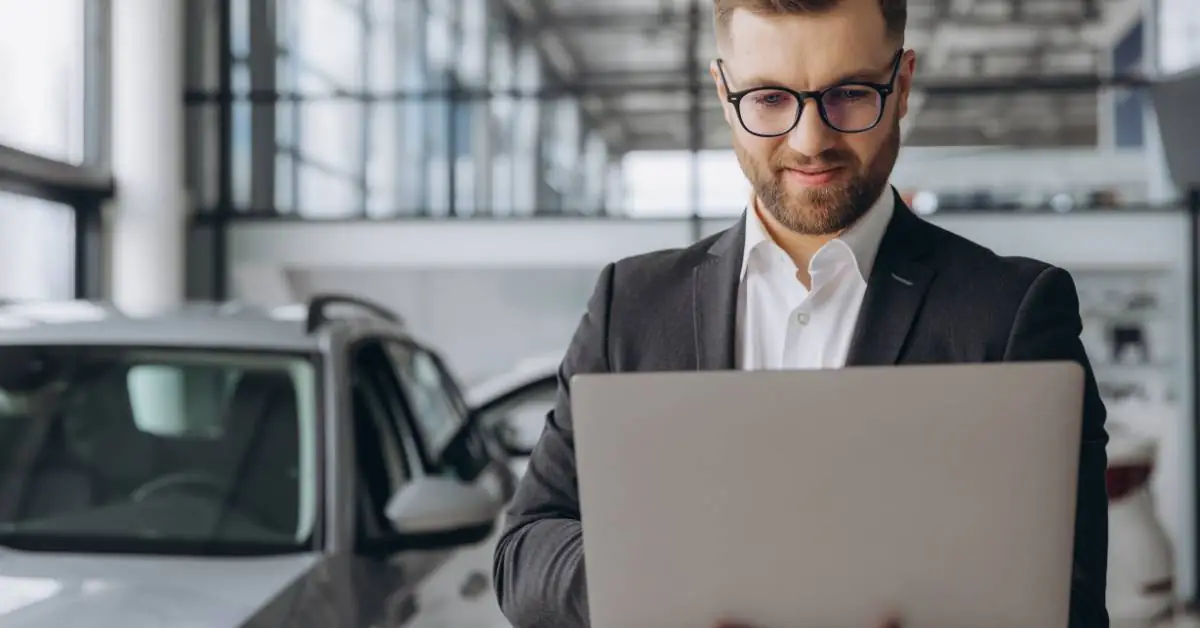 dealership accountant on computer